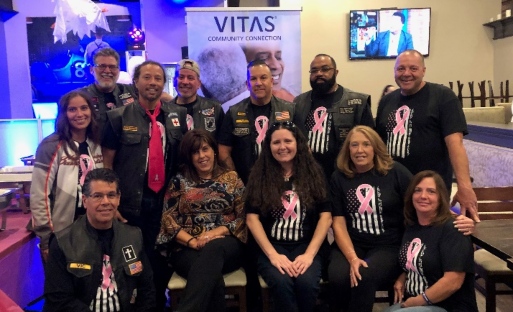 The group poses for a photo at the fundraiser